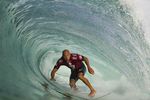 Kelly Slater of Florida, USA (pictured) riding a barrel to post a near perfect score during Round 1 of the Oi Rio Pro in Barra De Tijuca, Rio, Brasil on May 12, 2015.