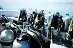 Close-up of underwater diving equipments on boat.