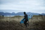 Mick Fanning heading for a soul surf in Lofoten, Norway in November 2016. Credit: Red Bull Content Pool